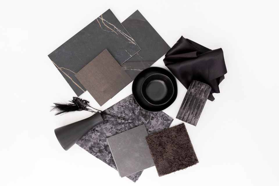 return to noir moodboard with cherry hardwood, marble veined tile and black carpet
